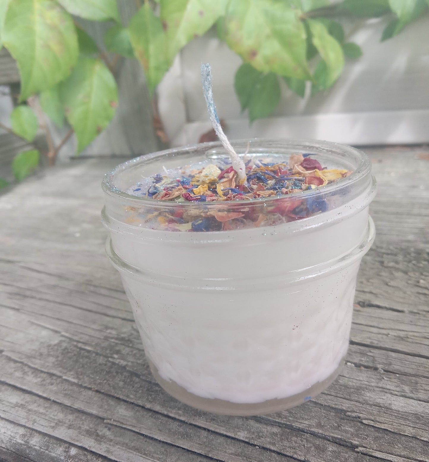 White Small Jar Candle with twine bow, dried herbs, and glitter